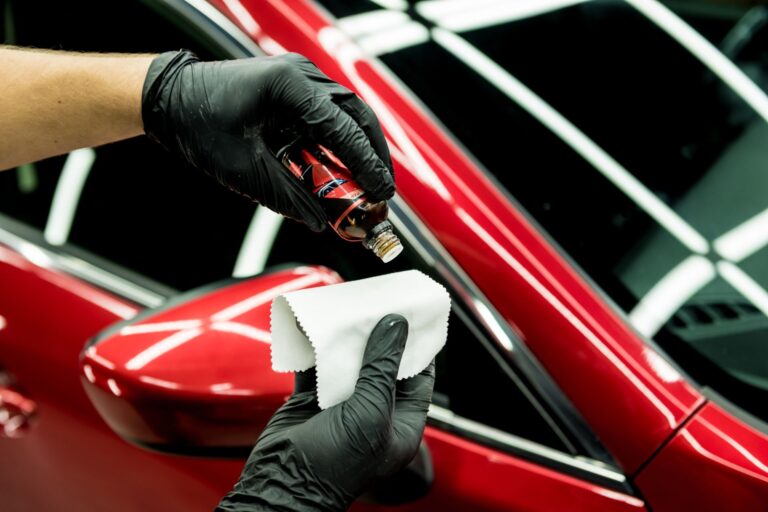 Auto Luxe technician applying ceramic coating in St. Petersburg, FL